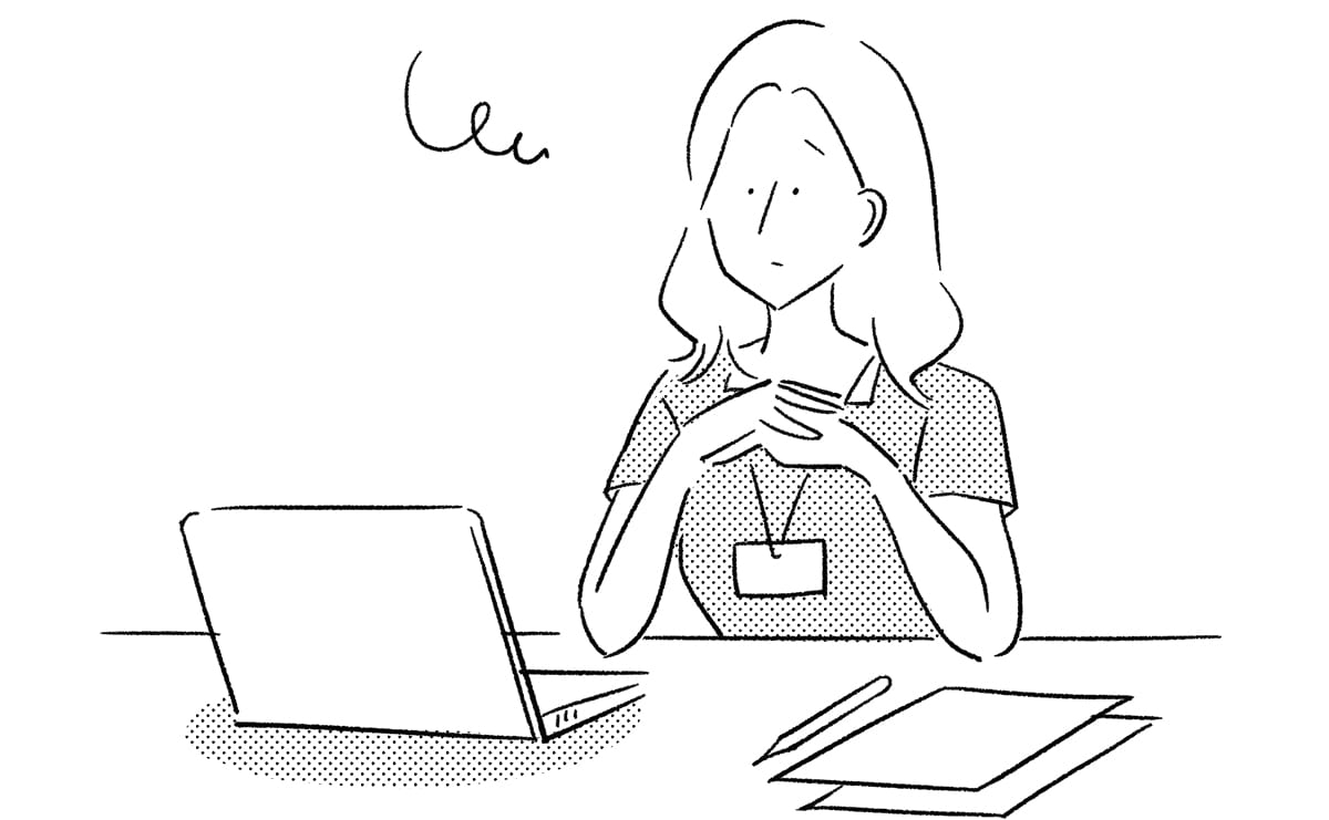 仕事中に浮かない表情の女性