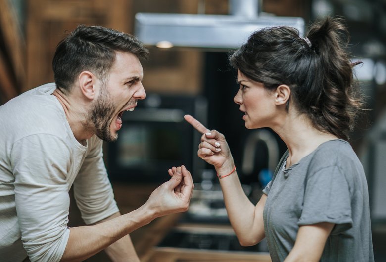 Furious couple arguing while having problems in their relationship.