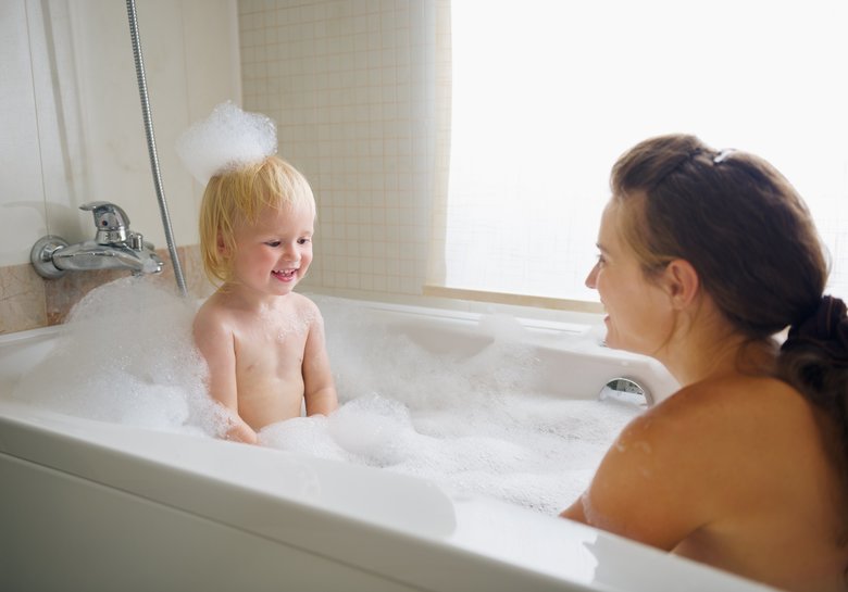 mother and baby taking bath