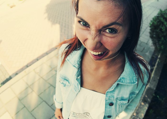 Funny portrait of young woman. Copy space. Top view.