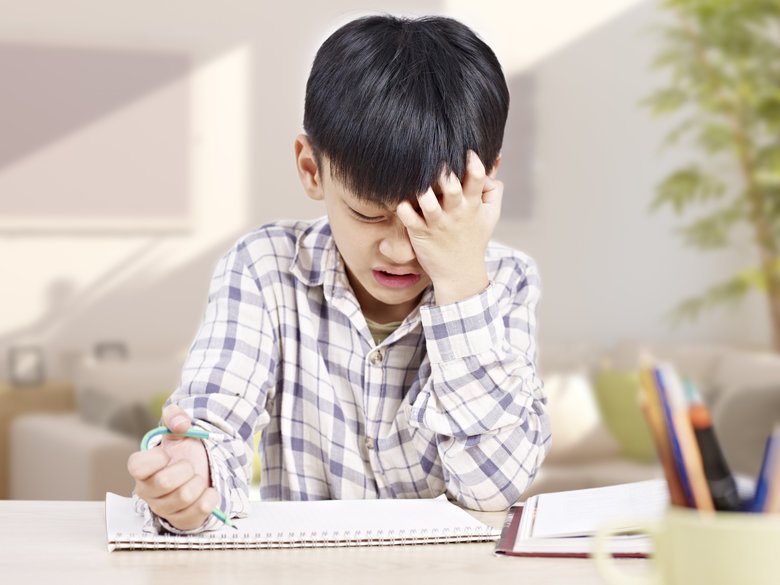 asian child studying at home