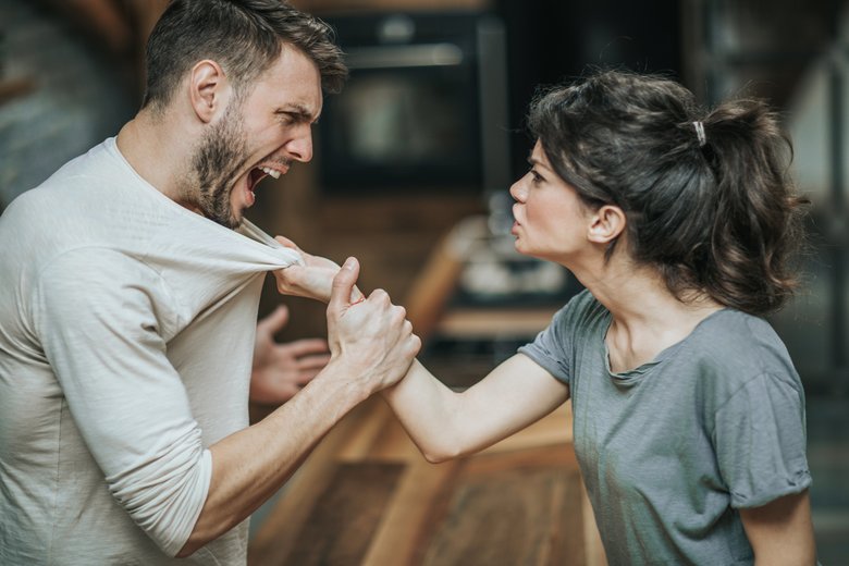 Aggressive couple arguing about their problems at home.