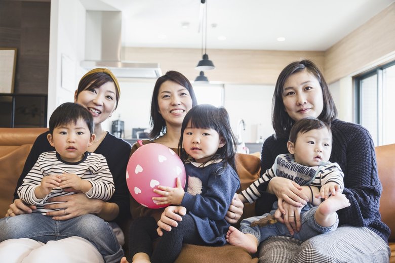 Mothers and kids watching TV