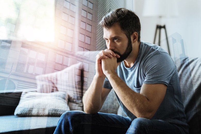 Thoughtful serious man sitting and thinking