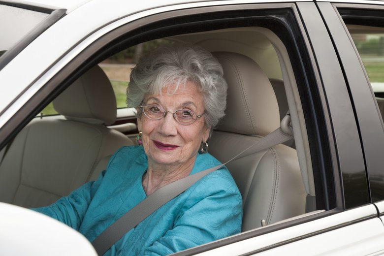 senior woman driving car