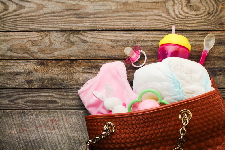 Mother's handbag with items to care for child