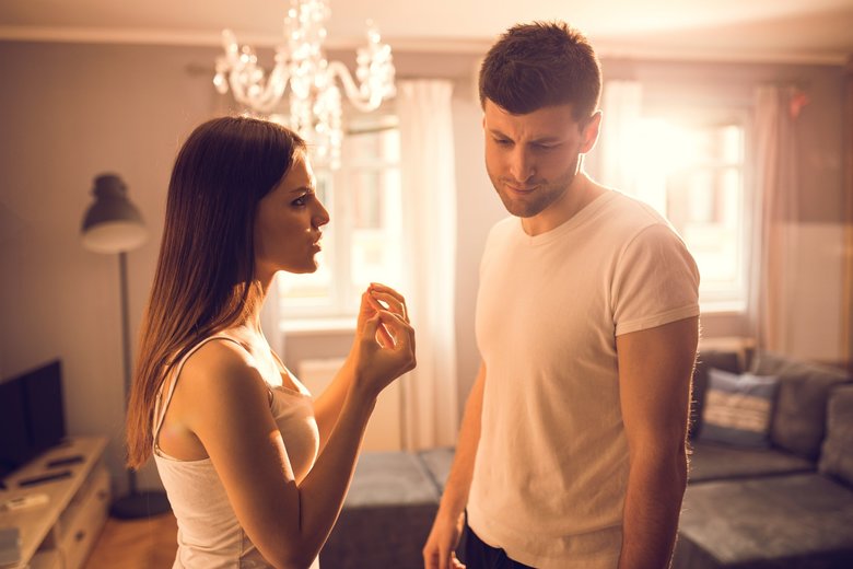 Young couple having discussion at home