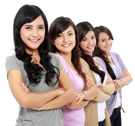 17685997 - group of beautiful women smiling isolated over a white background