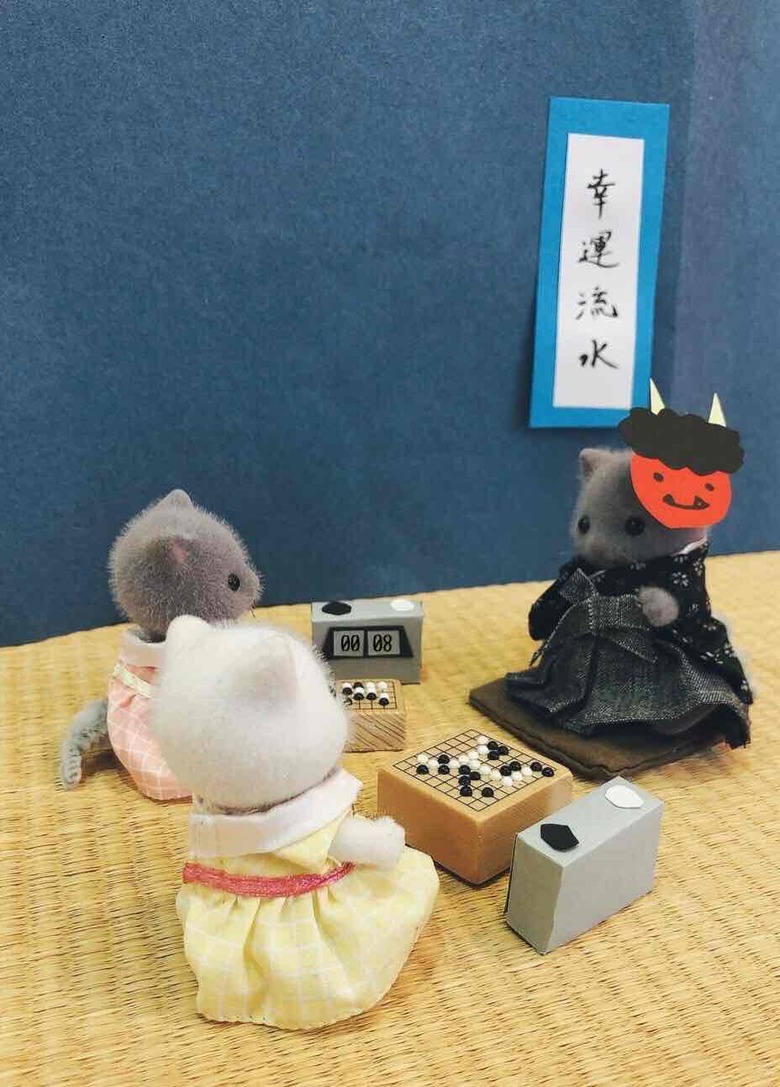 鬼のように強いパパには鬼面を。夫が娘二人と同時に対局する二面打ちをかわいく表現