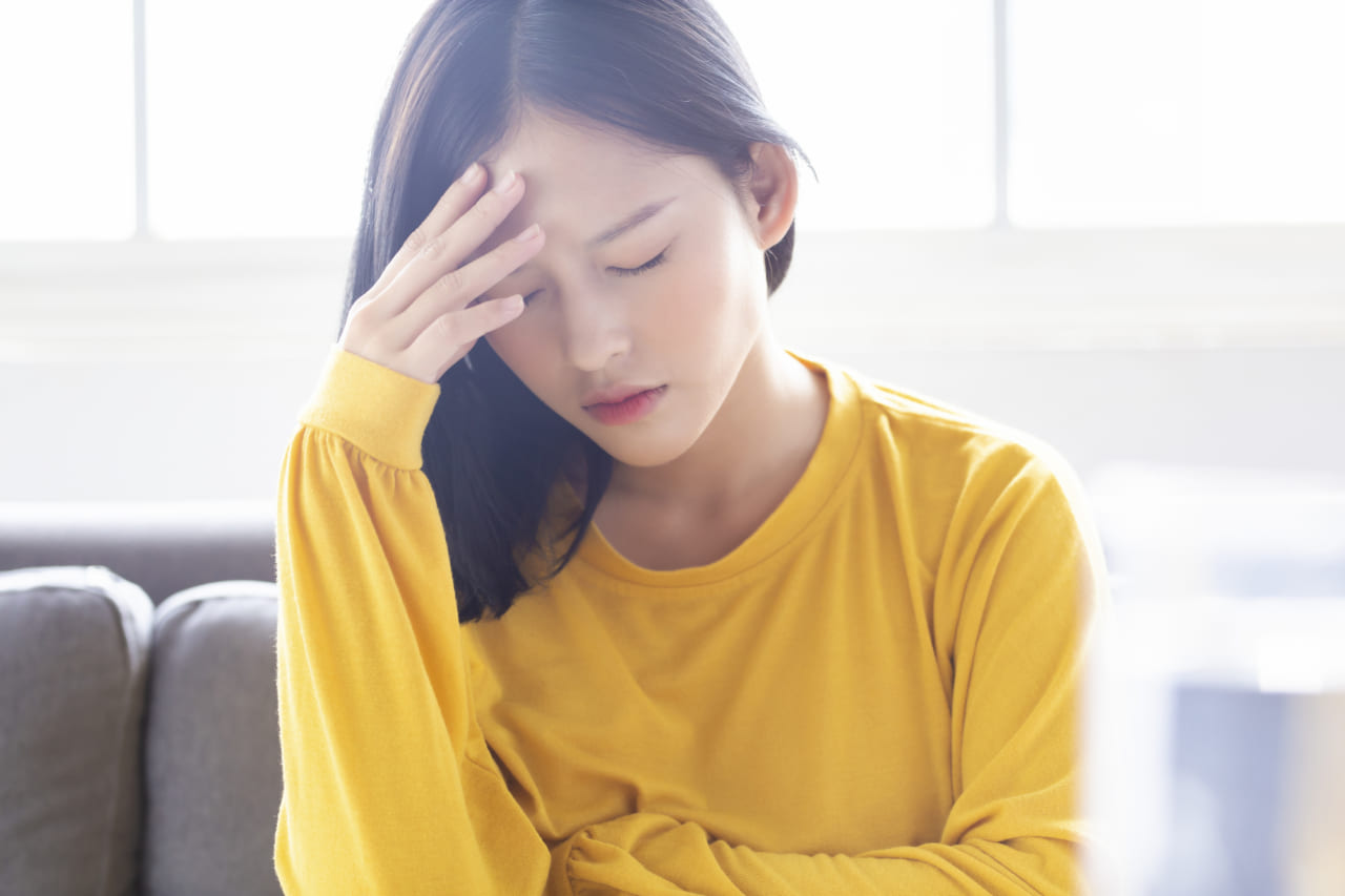 体調不良の女性