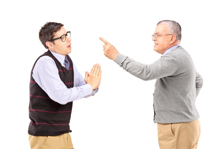 Young guy begging an older angry man