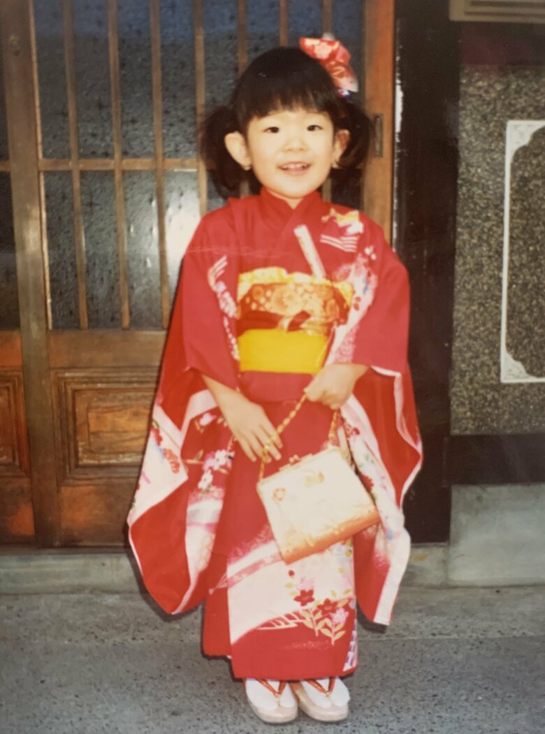 屈託のない笑顔は子どもの頃から変わらず。明るい性格でいつもニコニコの佐藤さん