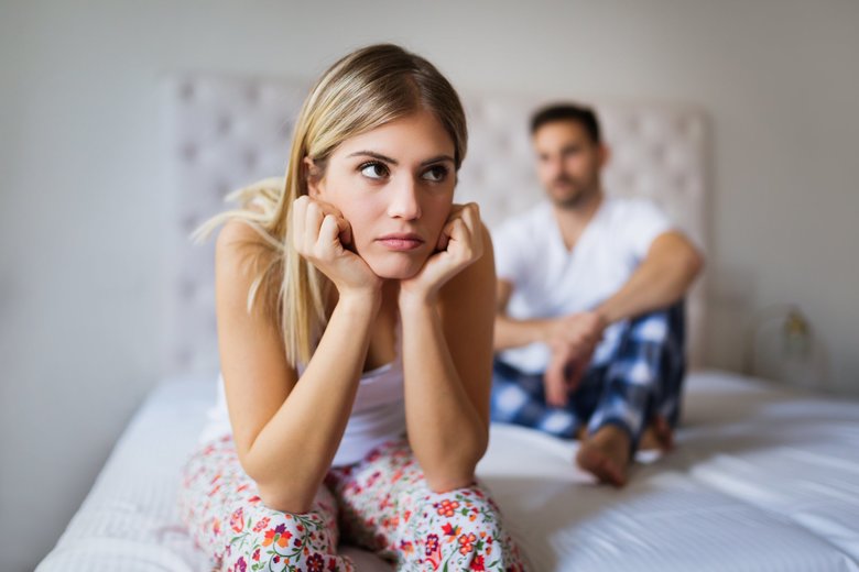 Young unhappy couple having problems in relationship