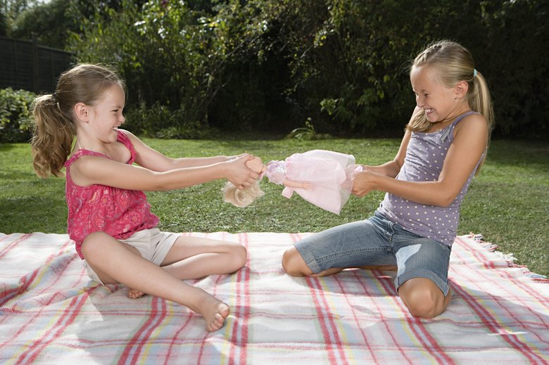 Girls fighting over doll