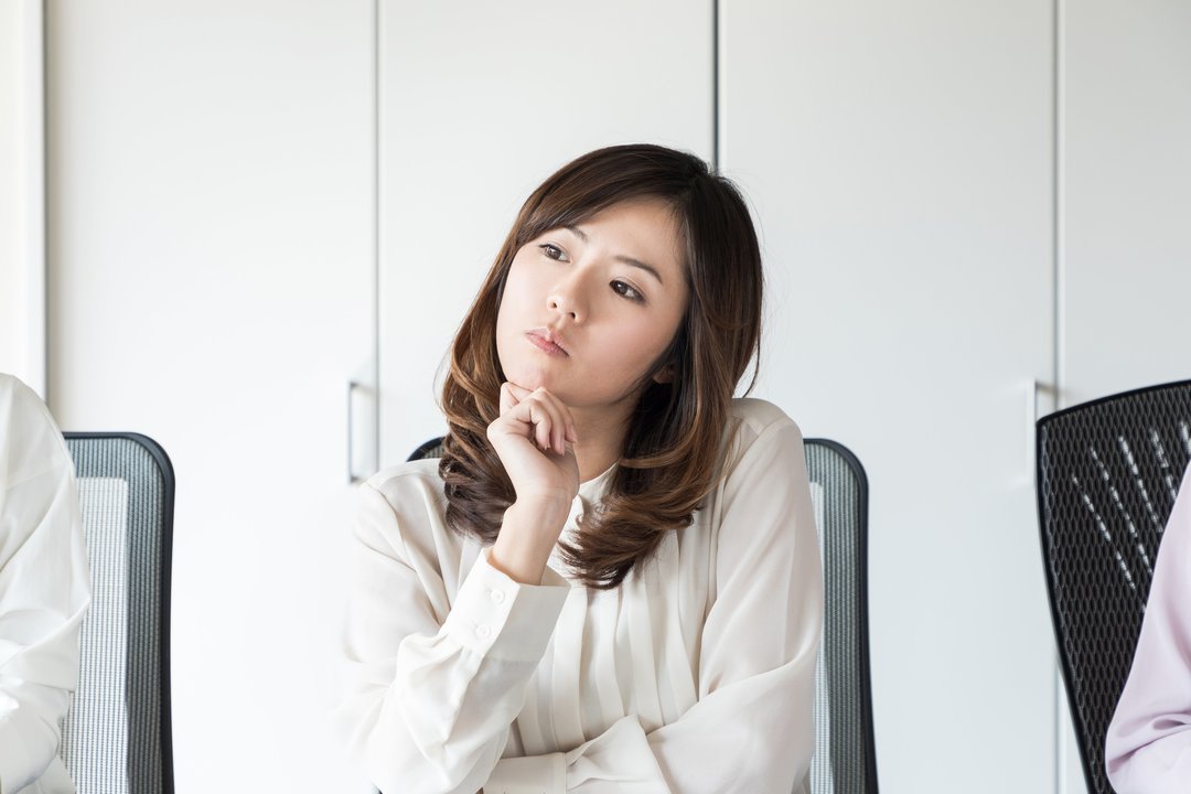 Thinking young woman.