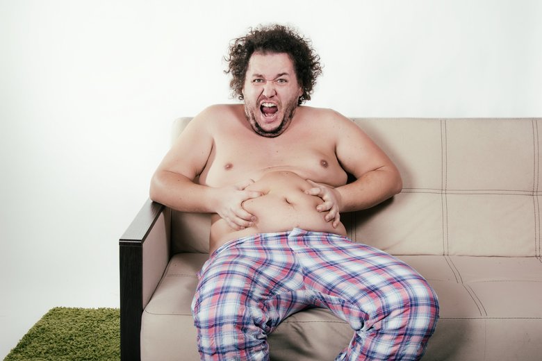 Diet and funny fat guy on the couch.