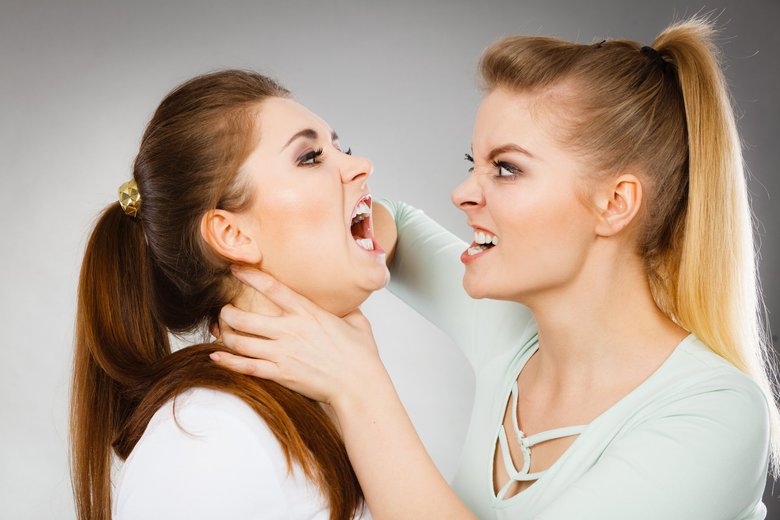 Two agressive women having argue fight