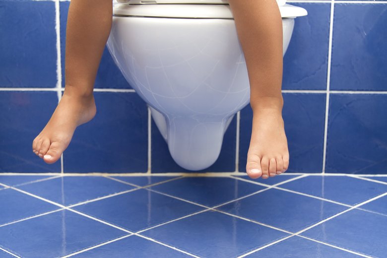 Child sitting on the toilet