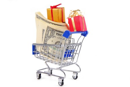 36439887 - shopping trolley with presents gifts and money  isolated on white