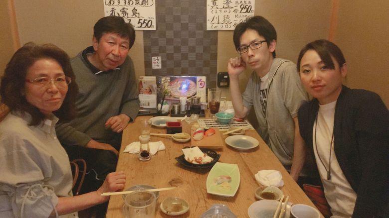 苦楽を共にした家族との写真