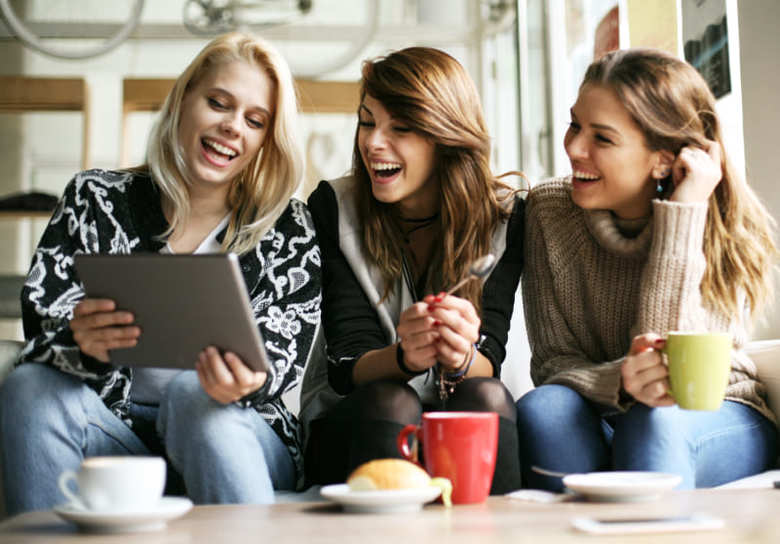 Women using digital tablet.